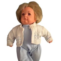 Petite 12" Gotz Artist Baby Doll, with a vinyl head and limbs and a cloth body, featuring facial sculpting by artist Hildegard Gunzel.  The doll is a 