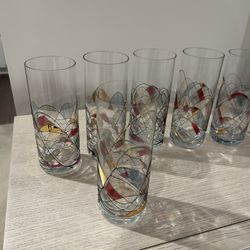 Two Martini Glasses And Six Drinking Glasses
