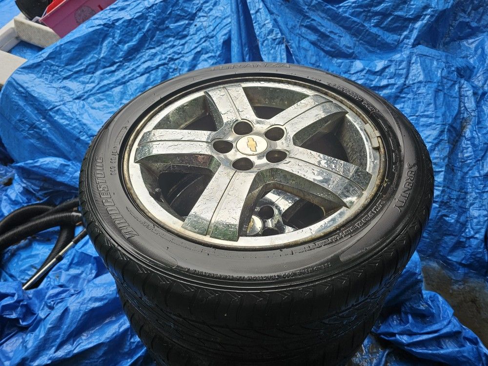 Set of 4 CHEVY 225/50/17 INCH CHROME RIMS WITH TIRES. (WHEELS)
