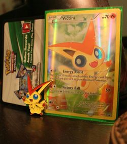 Pokemon victini and victini pin and Pokemon code card