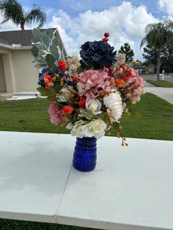Vase with artificial flowers