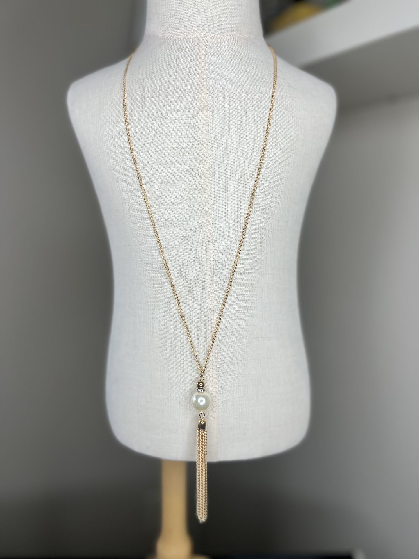 Long gold chain tassel fashion necklace with rhinestone and pearl detailing