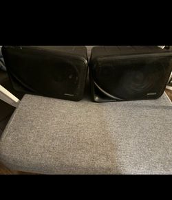 Pair of indoor out door Optimus box speakers no hardware sound decent asking 30 for pair don’t need
