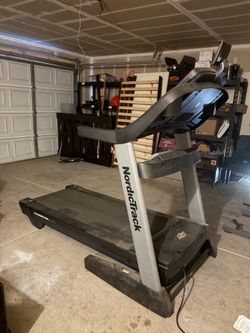 Treadmill and pull up bar