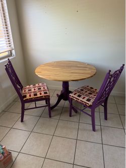 Round drop-leaf dining table