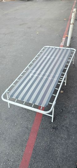 Portable folding cot or hideaway guest bed