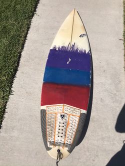 5’10 Surfboard with a 5 FCS fin set up