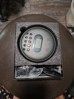 Arafuna portable cd player in box all directions and headphones.