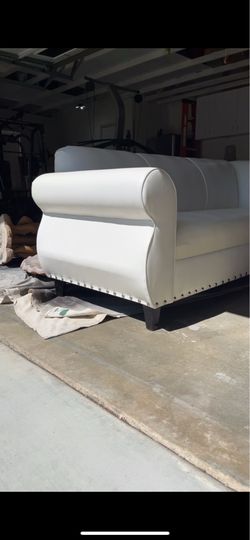 White leather sofa coach