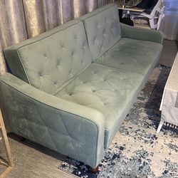 Velvet upholstered sofa cum bed