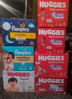 Cajas de pañales cantidad y talla en la fotografía 28 dólares cada una el precio firme