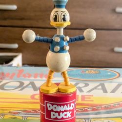 This is an extremely rare vintage figurine of Donald Duck, a beloved character from the Disney franchise. It is a highly sought-after collectible 