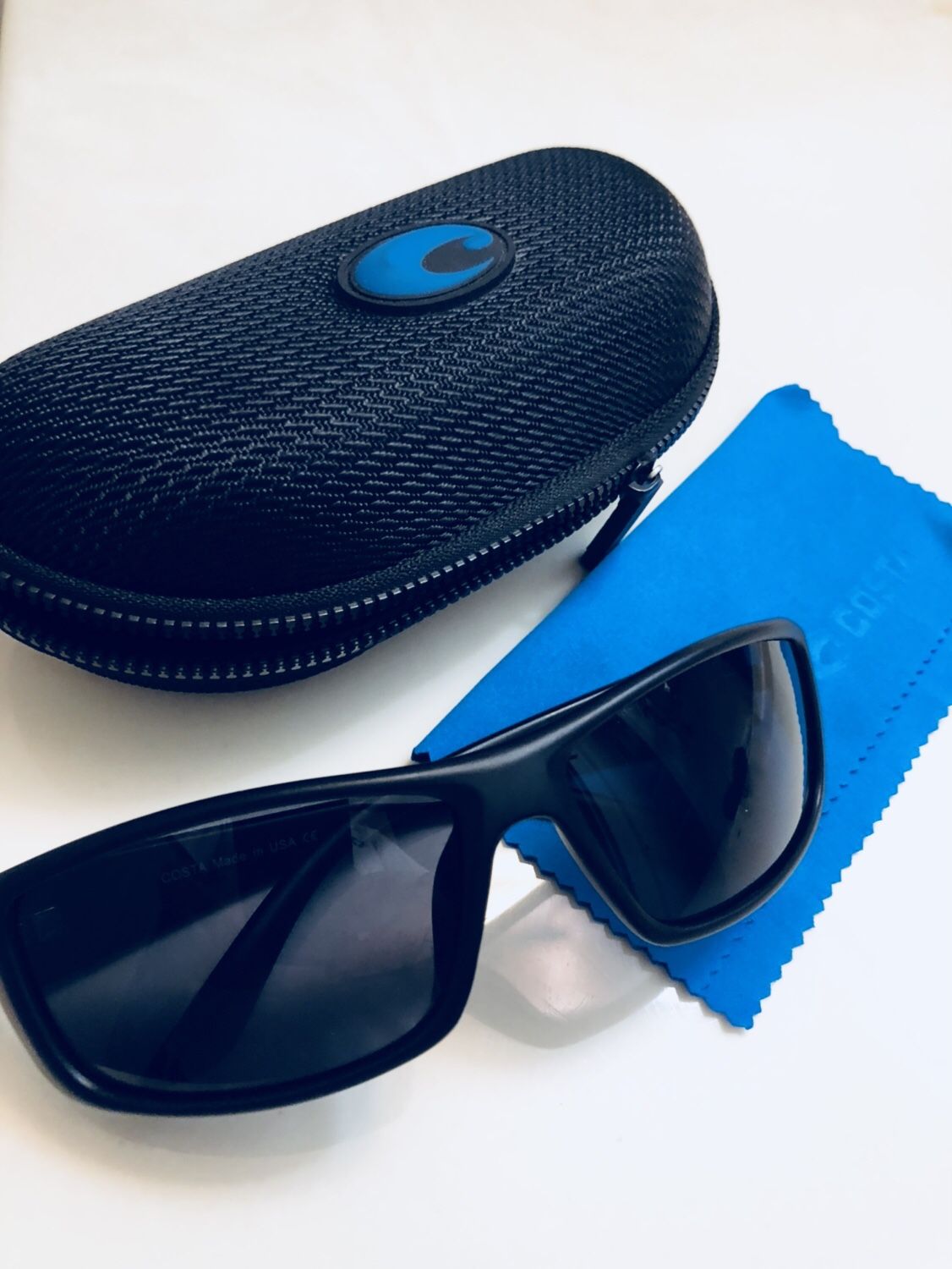 Costa’s Sunglasses w/ smoke-grey Polarized lens