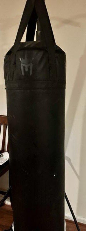 Heavy punching bag with stand.