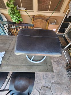 Black leather stool or foot stool. Perfect size for putting on shoes