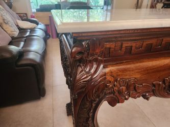 Ornate carved wood console with marble top