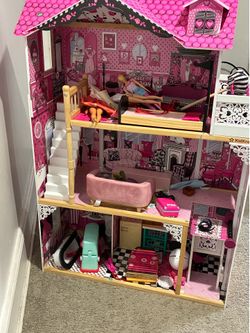 Little girl pink doll house