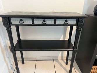 Refurbished Gray/black console table withthree small storage drawers, carved spindle legs. 3x3x1.5ft