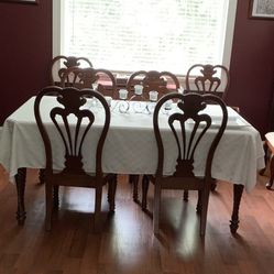 Dining room table and chairs with extender.