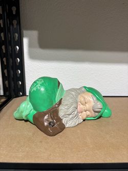 vintage 1960s to 1970s hand-painted ceramic sleeping garden gnome or pixie figurine