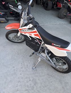 Razor MX650 Dirt Rocket Bike Tuttio Electric Ride-On for Ages 16+, 220 Ib Max Weight, Orange - 36V Battery, Up to 17 Mph, 40-Min Run Time, Twist-Grip