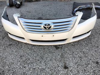 2006-2009 Toyota Avalon complete front bumper with all the accessories OEM.