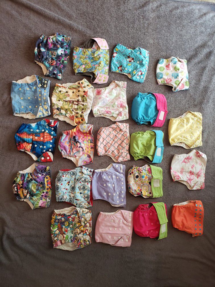 Lot of 22 Cloth Diapers One Size All in One with Snaps/Velcro with insert. No holes in the diaper, odor free, smoke and pets free home. Some are custo