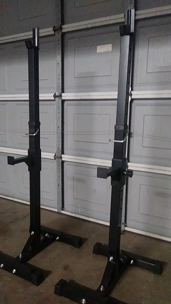 Adjustable squat/bench rack with adjustable safety pins. for Sale in