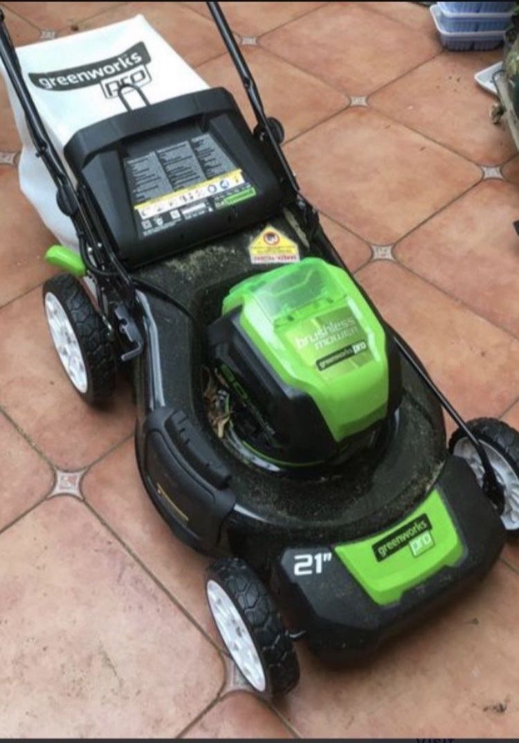 “ NEW “ 80 VOLT Greenworks 21” Steel Deck Self Propelled Mower Plus 80 Volt 16 Inch Chainsaw With 5 AH Battery And Charger Lawn Mower