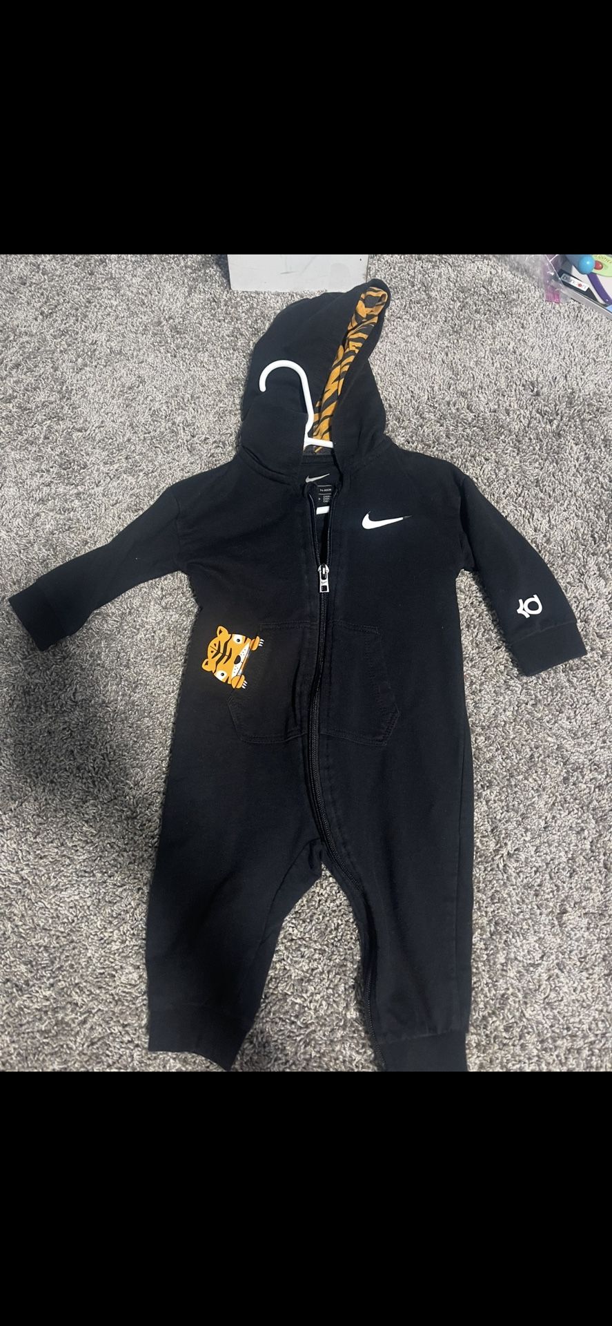 Nike black zip up onsie. Tiger 12 month