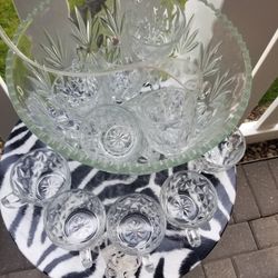 punch set contains 12 cups a large bowl and a ladle.