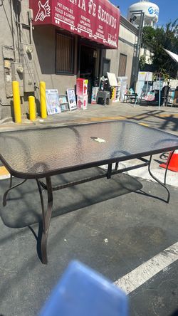 Outdoor metal and glass table
