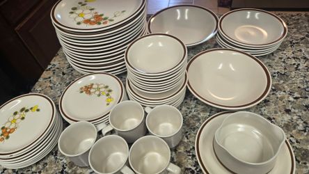 Vintage made in Japan Stoneware place setting plates bowels saucers and cups.