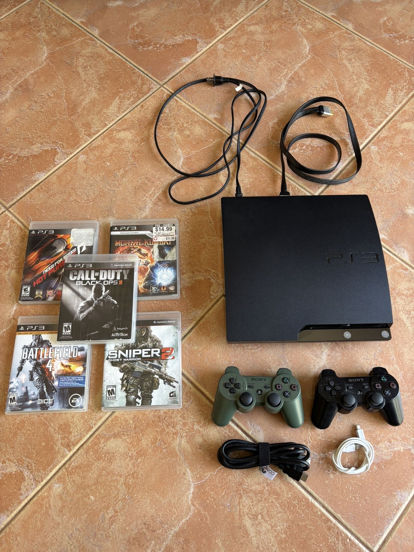 Play Station 3 with Two Remotes and Multiple Games