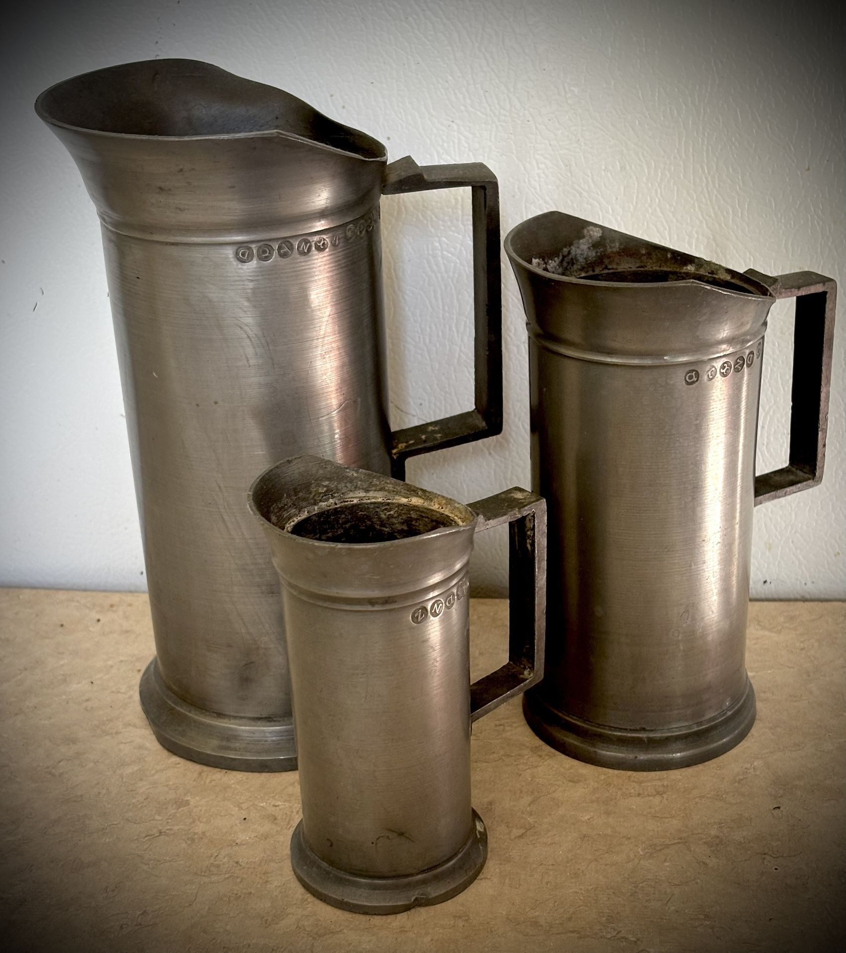 Antique pewter European Measuring Pitchers. Set Of 3