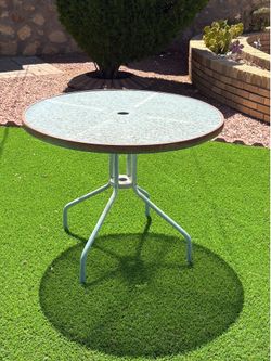 Glass and metal patio table