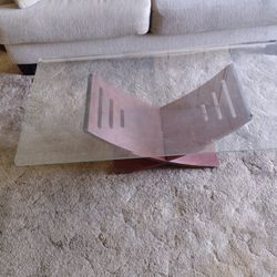 two end tables and a coffee table glass tops