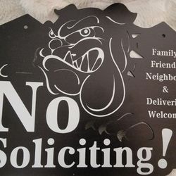 No soliciting metal sign new in plastic