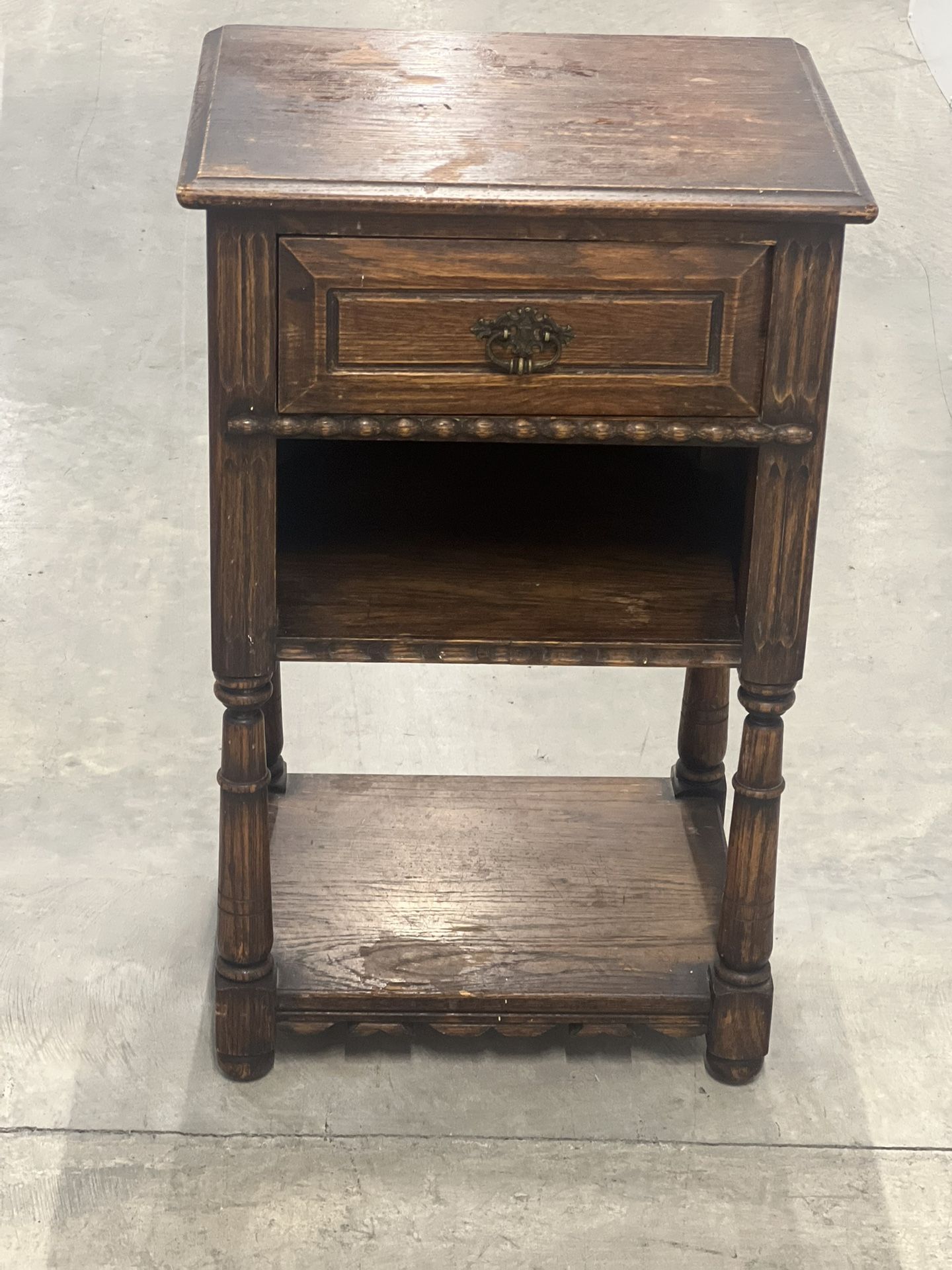 Vintage Solid Wood Nightstand Side Table 1 Drawer 2 Shelves Solid Wood. Used in good condition with some minor cosmetic blemishes. These blemishes ar