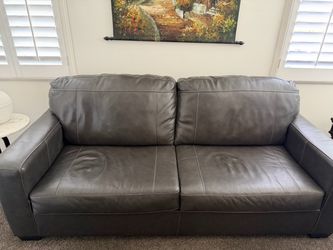 Grey leather sofa and armchair