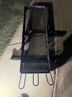 Heavy-duty cargo carrier; features slots to secure and transport bicycles.
