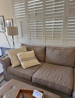 Tan Skirted Two-Cushion Sofa