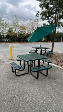 (Used) ULINE commercial-grade metal mesh picnic table w/ attached benches + large umbrella