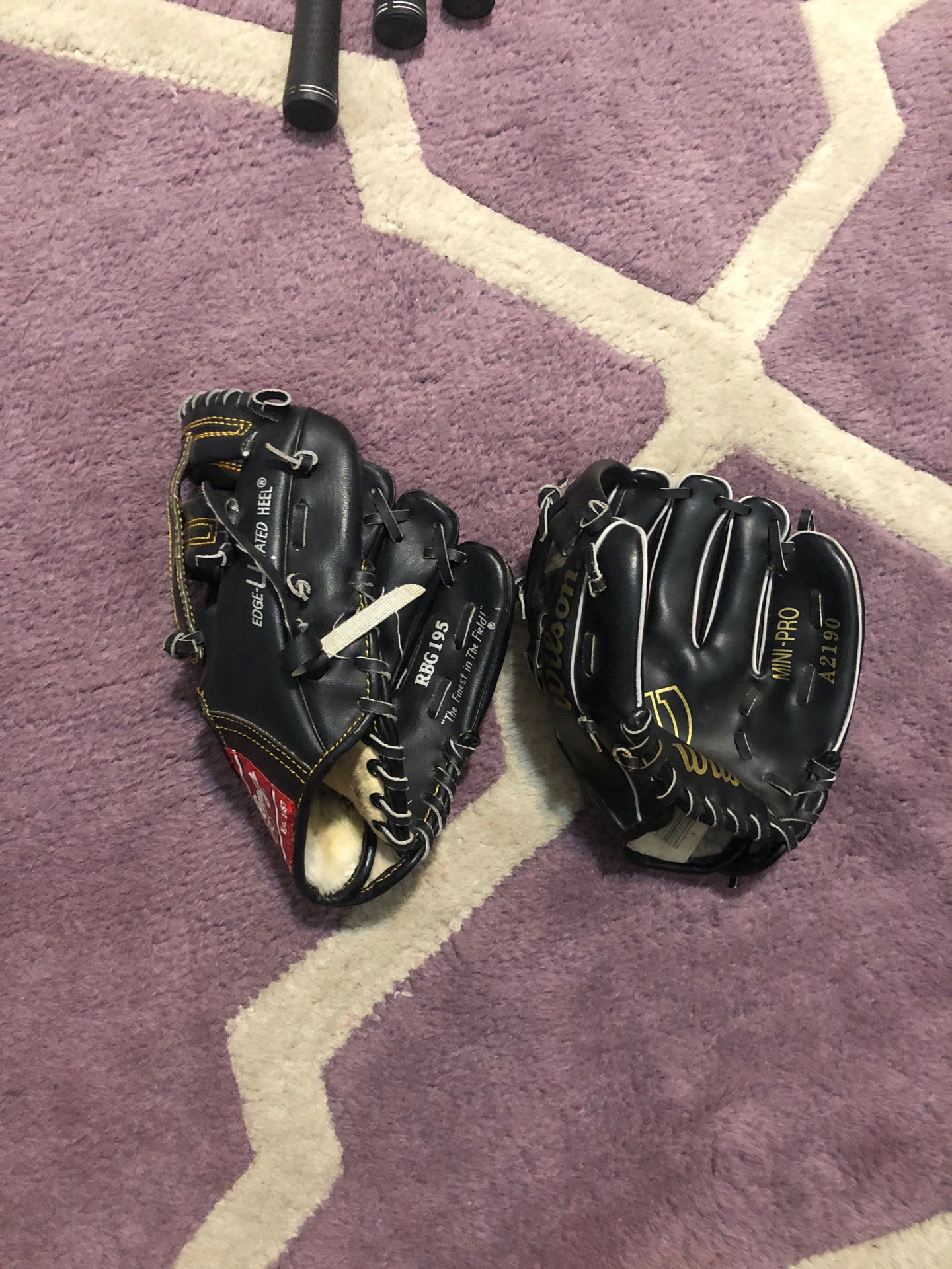 2 childs baseball gloves rawlings and wilson