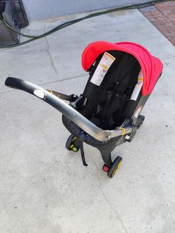 Doona Car Seat & Stroller, Flame Red - All-in-One Travel System (Exp 2029) Model sp101-10-031-003