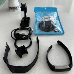 2 Fitbit Plus Several Charging Cables, “Sold As Is”