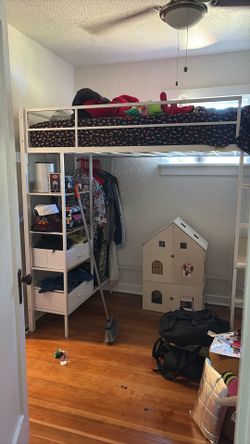Pretty much brand new white metal bunk bed with desk, closet system and fabric drawers.