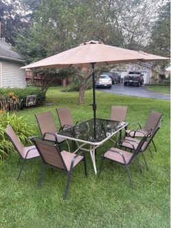 9-Piece Outdoor Patio Dining Set – Glass Table, 8 Chairs & Umbrella