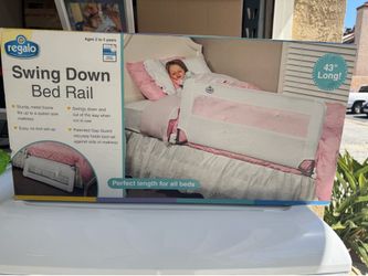 Swing down bed rail