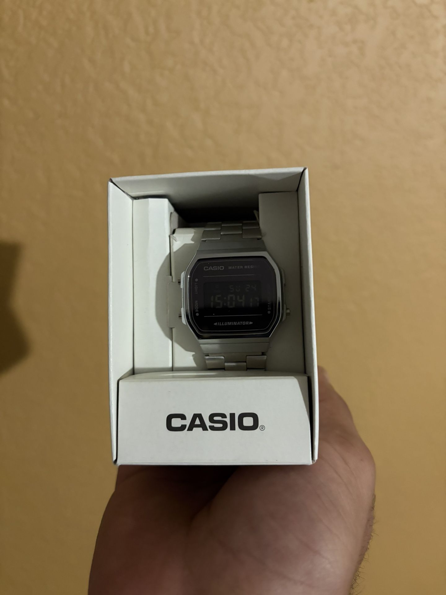 Silver casio watch